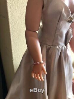 1956 Madame Alexander blonde Cissy doll in TLC Side Draped Satin Gown, flowers