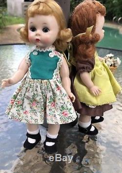 Lot of 2 1956 and 1957 Madame Alexander-kins tagged dress with pinafore